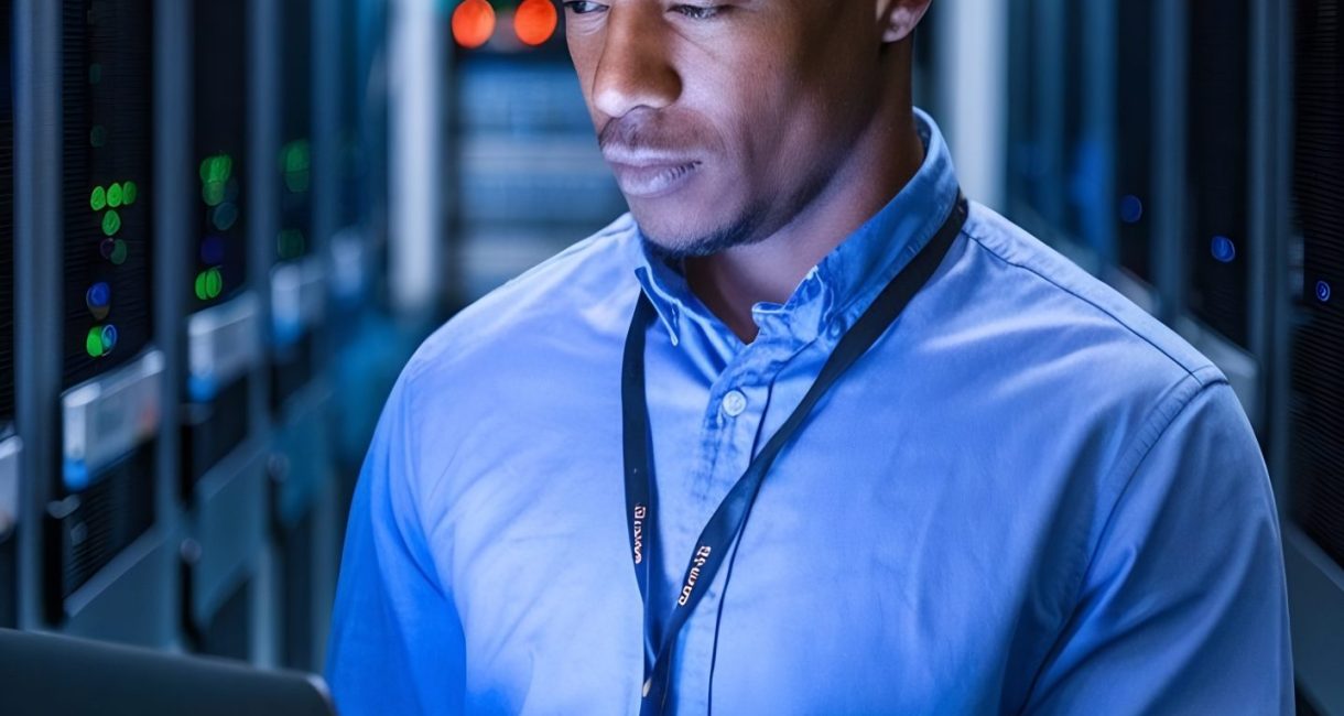 portrait-data-center-engineer-using-laptop-computer