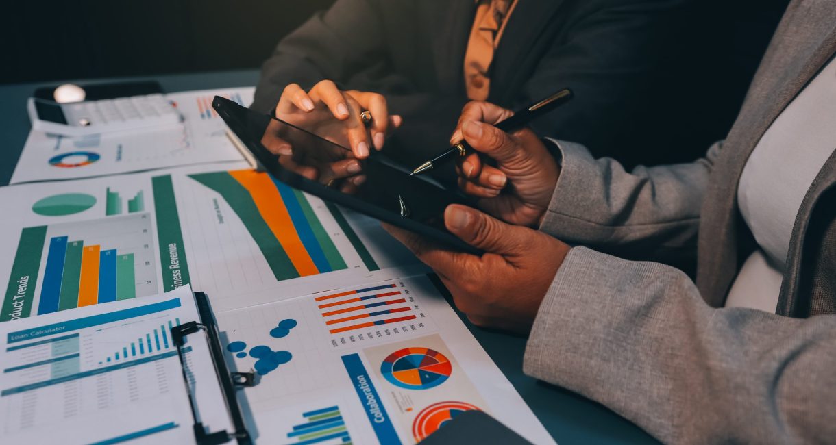 Team of business people are meeting to analyze data for marketing plan,Market research reports and income statistics, Financial and Accounting concept.